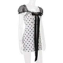 Polka dot bowknot zip-up puff sleeve top