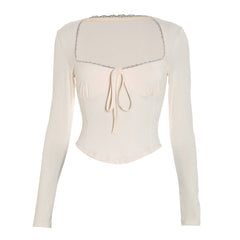 Long sleeve self tie lace hem top