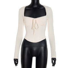 Long sleeve self tie lace hem top