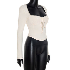 Long sleeve self tie lace hem top