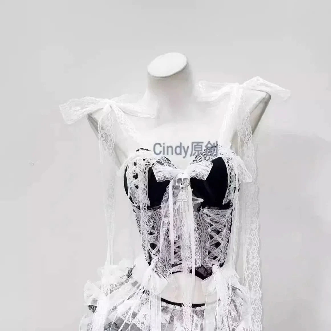 Lace hem v neck bowknot self tie skull applique top