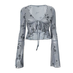 Long flared sleeve v neck self tie ruffle flower print top